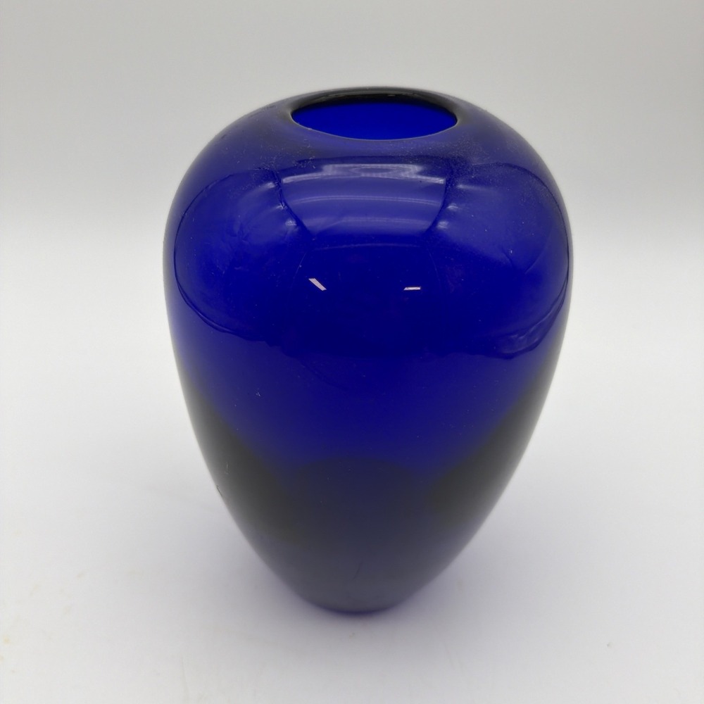 deep cobalt blue glass vase featuring a smooth rounded silhouette